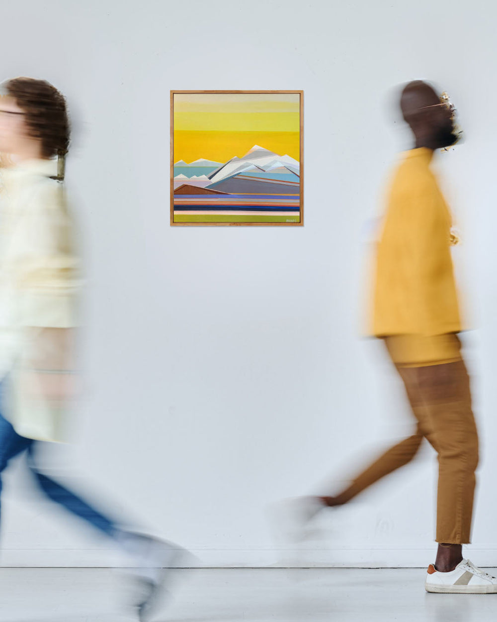 Sunshine Days original geometric abstract mountain painting by Shilo Ratner displayed in a contemporary interior.