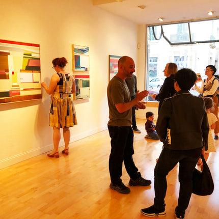 Opening reception for Hidden Depth, Shilo Ratner solo exhibition at Bryant Street Gallery, Palo Alto, May 2019 — guests viewing geometric abstract paintings