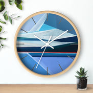 Artist Shilo Ratner, Original 10in x 10in Clock with abstract design on a white wall with a plant and small pot below.